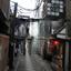Small narrow city street with paved walkway..jpg
